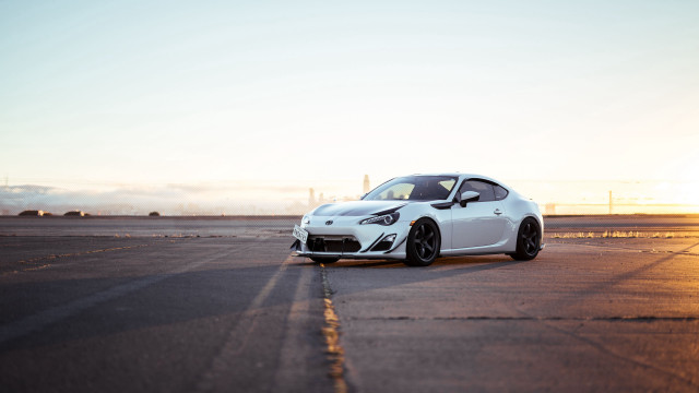 White sports car runway sunset free wallpaper for desktop - medium preview image