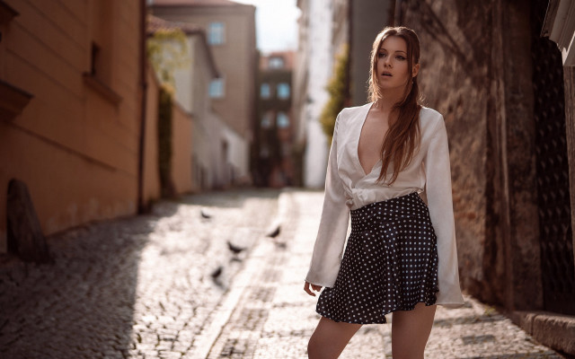 Woman cobblestone street white blouse free wallpaper for desktop - medium preview image