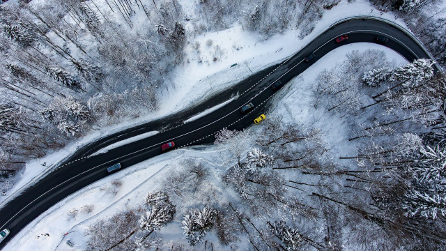 Snowy forest road yellow car free wallpaper for desktop - medium preview image