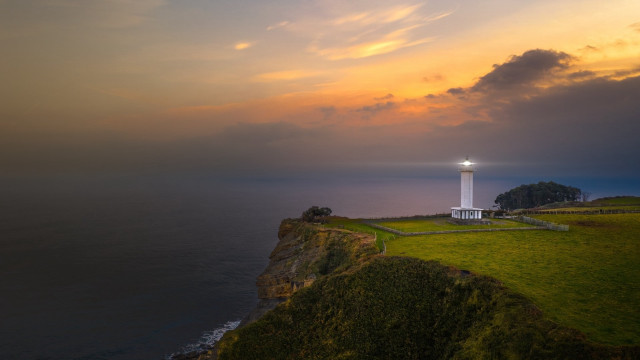 Lighthouse cliff ocean sunset cityscape #2 free wallpaper for desktop - medium preview image