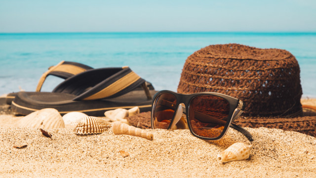 Beach hat sunglasses flipflops sand free wallpaper for desktop - medium preview image