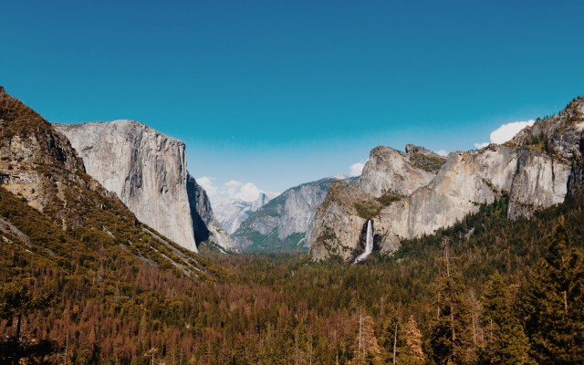 Mountain range valley forest cliff free wallpaper for desktop - medium preview image