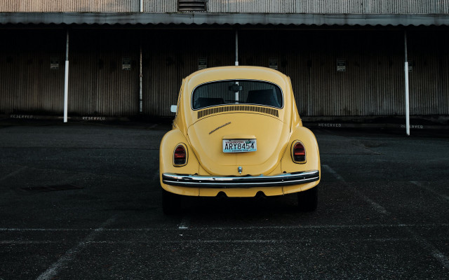 Yellow car parking lot building #3 free wallpaper for desktop - medium preview image