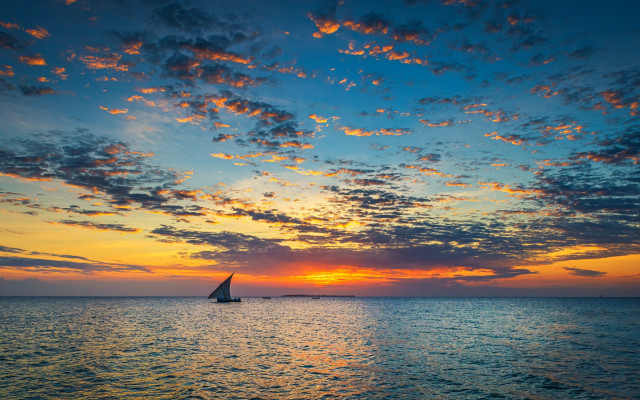 Sailboat ocean sunset island sky free wallpaper for desktop - medium preview image