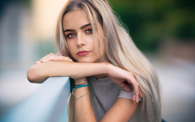 Blonde woman portrait serious wall free wallpaper for desktop - medium preview image