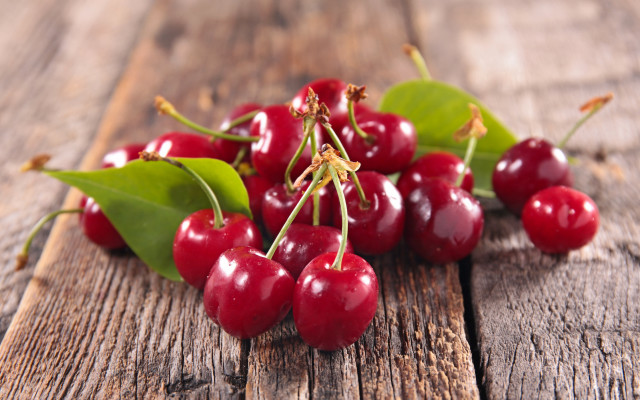 Cherries wooden table leaves blurry free wallpaper for desktop - medium preview image