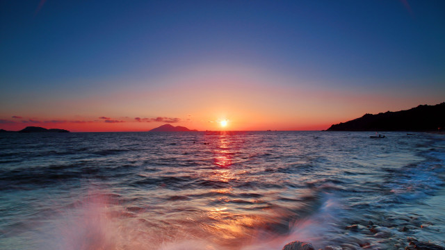 Sunset ocean boat mountain sky free wallpaper for desktop - medium preview image
