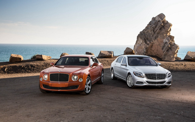 Two luxury trucks rocky beach free wallpaper for desktop - medium preview image