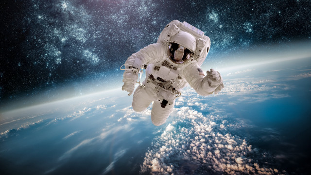Astronaut space starry sky clouds free wallpaper for desktop - medium preview image