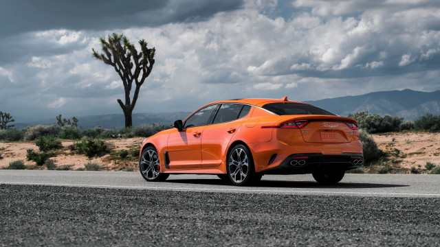 Orange sports car desert road free wallpaper for desktop - medium preview image