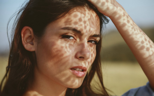 Freckled asian woman concerned photorealistic free wallpaper for desktop - medium preview image