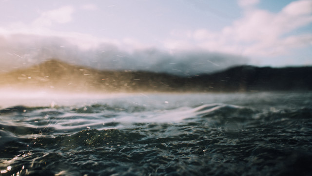 Blurry water mountain clouds ocean free wallpaper for desktop - medium preview image