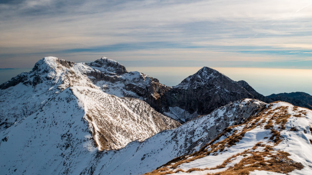 Mountain range snowy cloudy horizon free wallpaper for desktop - medium preview image