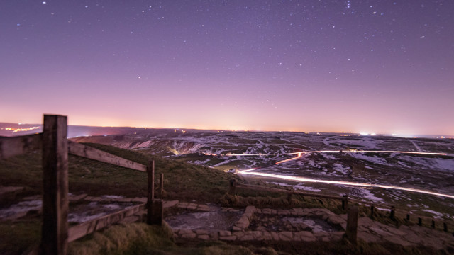 Mountain road city lights night free wallpaper for desktop - medium preview image