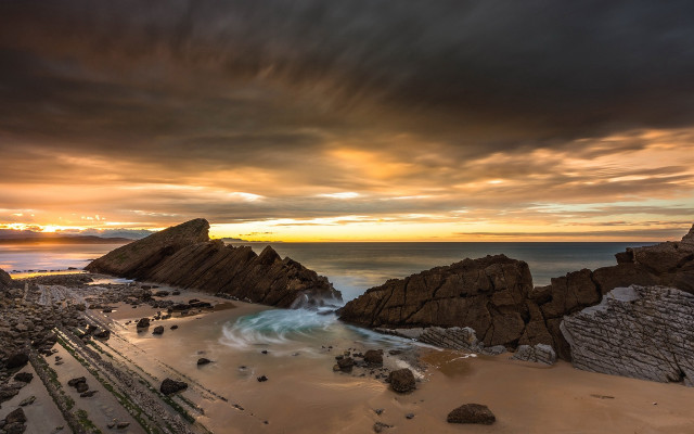 Beach rock formation water sunset free wallpaper for desktop - medium preview image