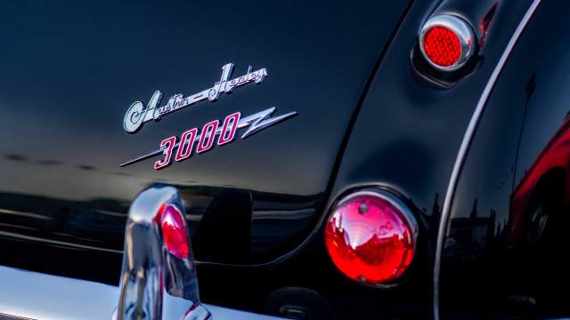 Black car red tail light free wallpaper for desktop - medium preview image