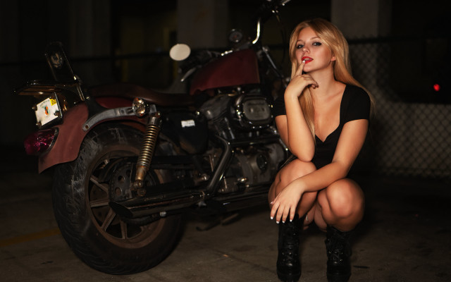 Woman motorcycle garage night portrait free wallpaper for desktop - medium preview image