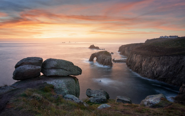Rocky cliff sunset water boat free wallpaper for desktop - medium preview image