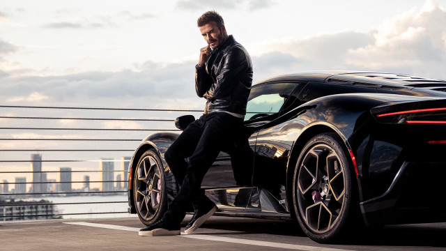 Man black sports car city free wallpaper for desktop - medium preview image