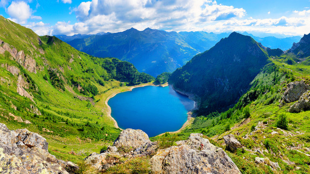 Lake mountains grass sunny clouds free wallpaper for desktop - medium preview image