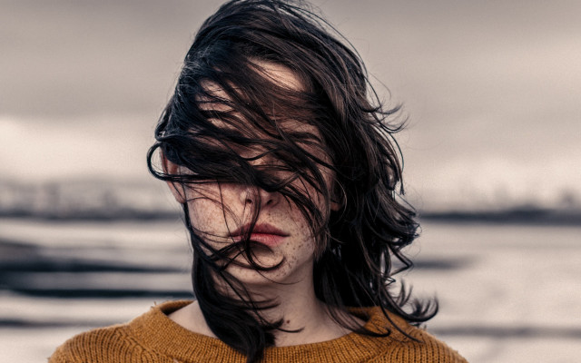 Woman blowing hair brown sweater free wallpaper for desktop - medium preview image