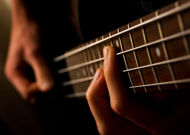 Person playing guitar fingers strings free wallpaper for desktop - medium preview image