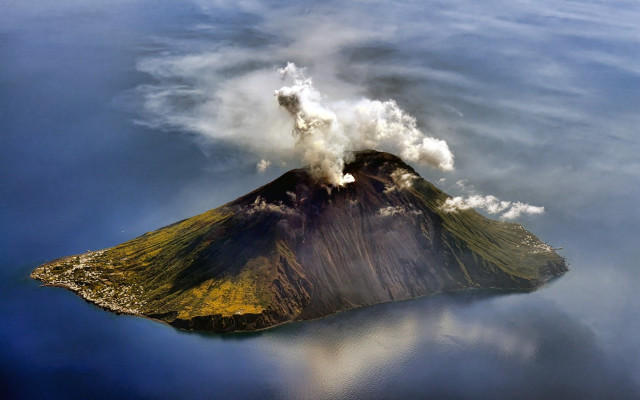 Small island smoke water aerial free wallpaper for desktop - medium preview image