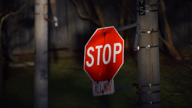Stop sign pole night house free wallpaper for desktop - medium preview image