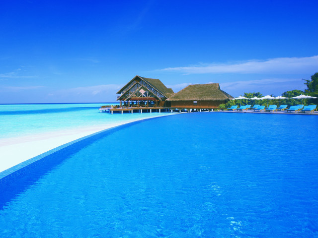 Large pool thatched roof beach free wallpaper for desktop - medium preview image