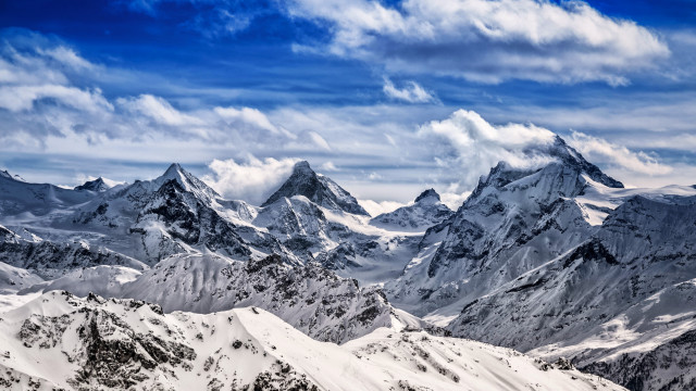 Mountain range snowy peaks clouds free wallpaper for desktop - medium preview image