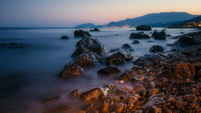 Rocky beach mountain dusk water free wallpaper for desktop - medium preview image