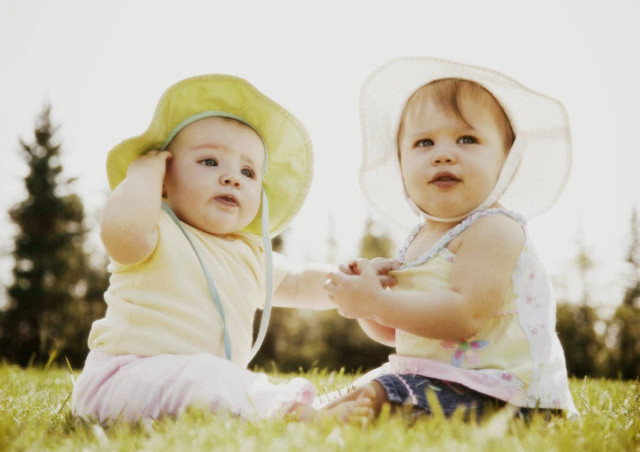 Babies grass hats holding hands free wallpaper for desktop - medium preview image