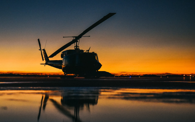 Helicopter tarmac sunset reflection water free wallpaper for desktop - medium preview image