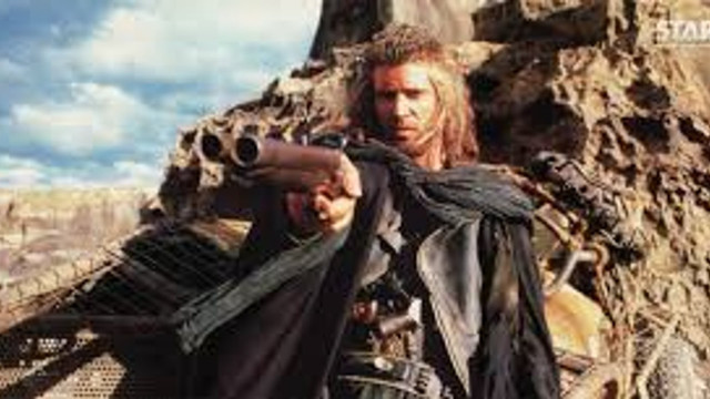 Man holding gun mountain sky free wallpaper for desktop - medium preview image