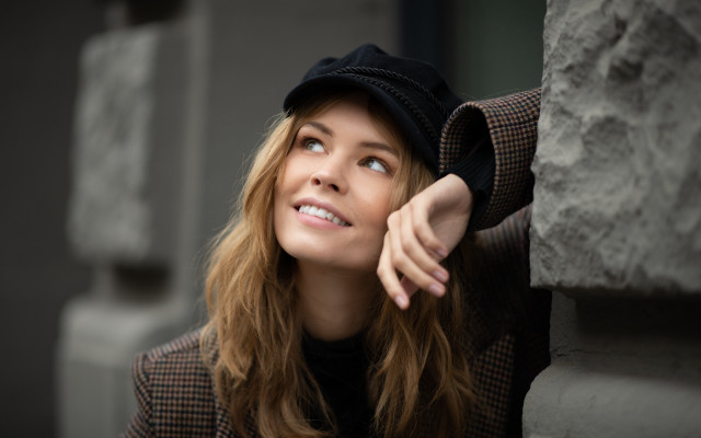 Woman smiling leaning wall blonde free wallpaper for desktop - medium preview image