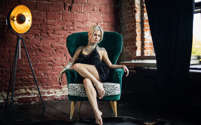 Woman tattoo chair brick wall free wallpaper for desktop - medium preview image