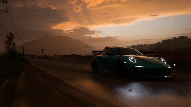 Green sports car night mountains free wallpaper for desktop - medium preview image