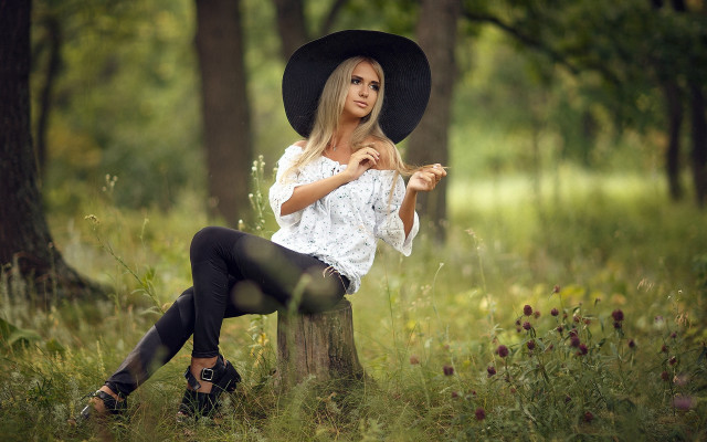 Woman black hat forest sitting free wallpaper for desktop - medium preview image