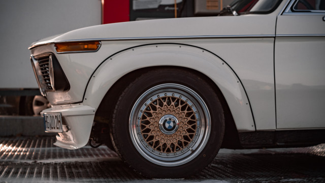 White car brown rim garage free wallpaper for desktop - medium preview image