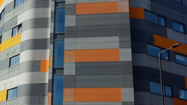 Skyscraper clock streetlight fence fishnets free wallpaper for desktop - medium preview image