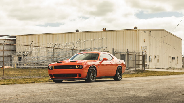 Red sports car building fence free wallpaper for desktop - medium preview image
