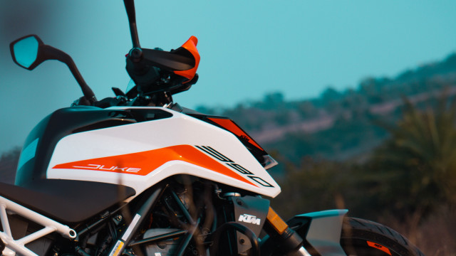 White orange motorcycle forest hill free wallpaper for desktop - medium preview image