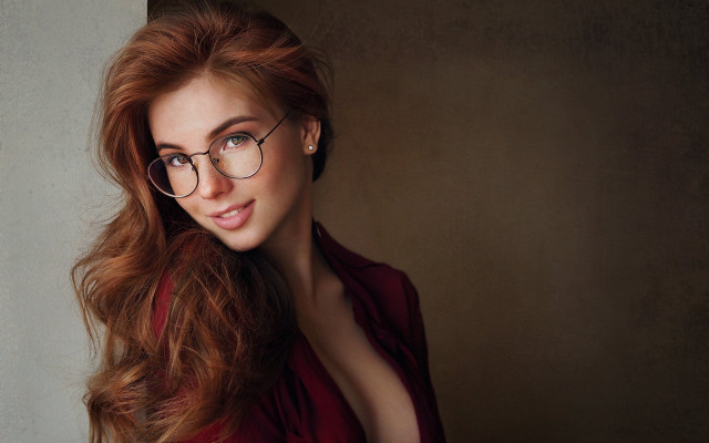 Woman glasses blowing hair portrait free wallpaper for desktop - medium preview image