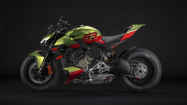 Green red motorcycle dark room free wallpaper for desktop - medium preview image