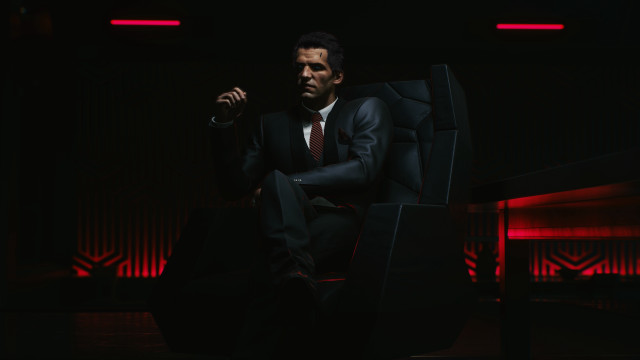 Man in suit sitting red free wallpaper for desktop - medium preview image