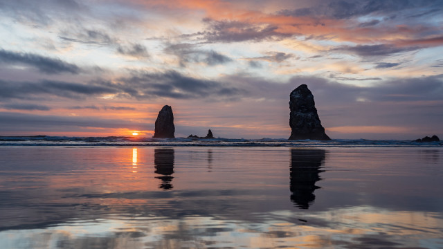 Sunset reflection rock formation beach free wallpaper for desktop - medium preview image