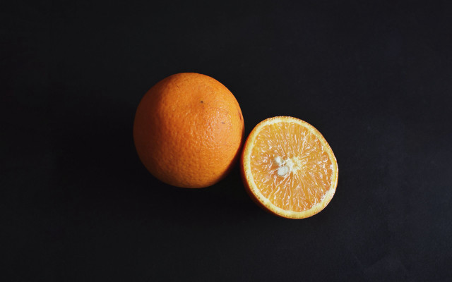 Orange slice minimalist stilllife black free wallpaper for desktop - medium preview image