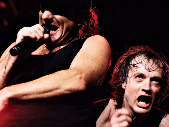 Two men singing microphones stage free wallpaper for desktop - medium preview image