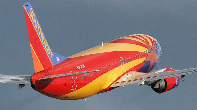 Red yellow airplane flying landing free wallpaper for desktop - medium preview image