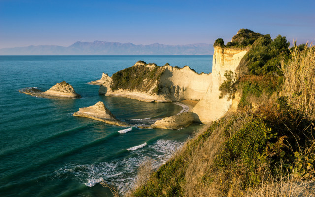 Exekias beach cliff waves ocean free wallpaper for desktop - medium preview image